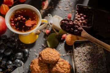 Dark food: herbal tea in a cup. Clipart photo