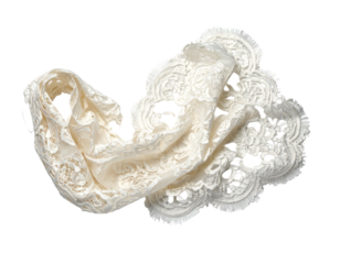 Ivory lace textile draped, intricate patterns and scalloped edges on dark backdrop