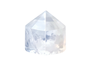 Transparent, faceted crystal in a hexagonal shape, isolated on a black background