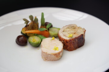 Elegant culinary presentation of a delicious main course with vegetable garnishes