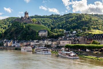 Cochem, Germany - September 9, 2025: Panoramic view of the Moselle River in the town of Cochem with Reichsburg Castle in the background