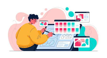 A designer working on a tablet with various design interfaces displayed on the screen