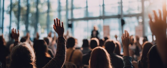 The Audience Engaged at a Conference Raising Hands During a Seminar Presentation