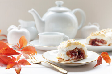 Homemade meringue roll with apples and lingonberries