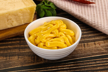 Yellow cheese sauce in the bowl