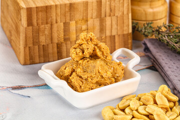 Crunchy peanut butter fat product