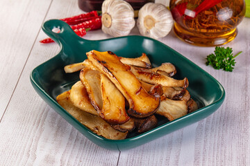 Roasted eringi mushrooms in the plate