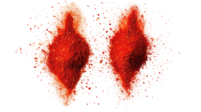 Two fiery red chili peppers exploding with spices isolated on transparent background