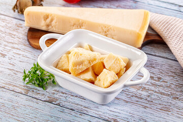 Parmesan cheese pieces in the bowl
