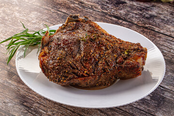 Baked beef steak on the bone