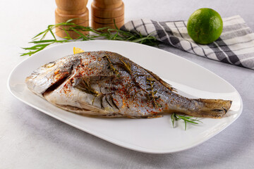 Baked dorada fish with spices
