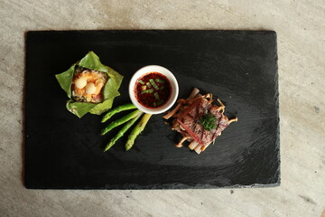 Appetizing Thai Food Arrangement on a Black Slate Platter