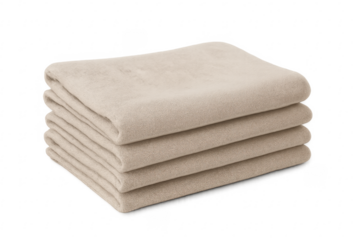 Stacked beige folded textiles on transparent background