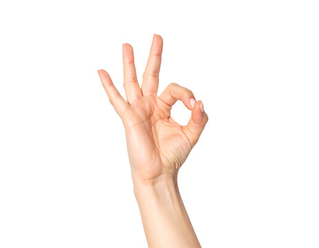 A close-up shot of a hand giving the "OK" gesture (A-OK/perfection) with the thumb and index finger forming a circle, isolated against a light gray background. - Powered by Adobe