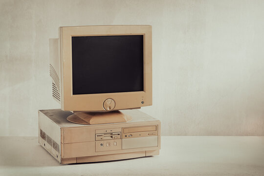 Old and obsoleate personal computer on grunge floor and background