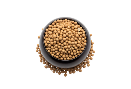 Whole dried coriander seeds in a dark wooden bowl, isolated on white from above.

