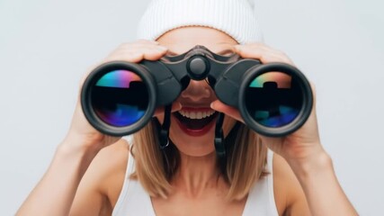 Happy woman with an open mouth expression holding binoculars, symbolizing a search for vision, exploration, and future trends - Powered by Adobe