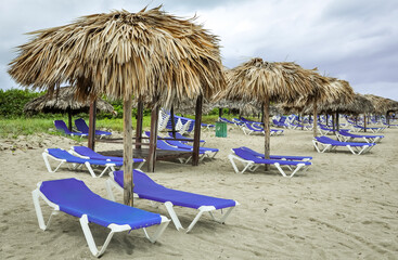 Lounge chairs and huts on the beach