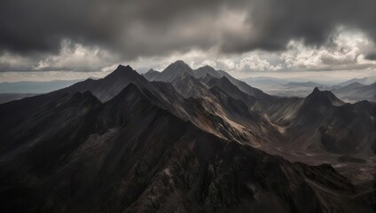 Dramatic mountain range under a stormy sky, a breathtaking landscape.