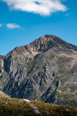 A bare rock mountain peak in plateau regions