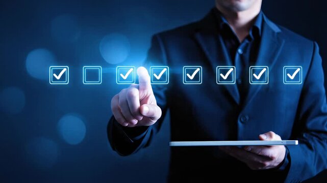 Businessman selecting virtual check boxes on a digital screen using futuristic technology to complete online tasks and management processes.
