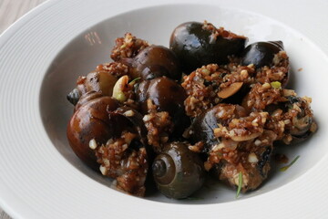 Delicious gourmet snails dish served in a pristine bowl ready to be enjoyed
