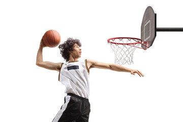 Basketball player in the air in a slam dunk pose © Ljupco Smokovski