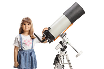 Little girl standing next to a telescope