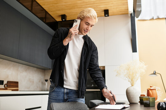 Young man engaged in conversation while at home workspace, creating a productive environment