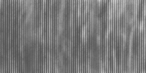 Abstract gray metallic texture pattern with steel lines and corrugated surface design for an industrial wallpaper backdrop