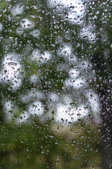 Close up of raindrops on a window on a rainy day