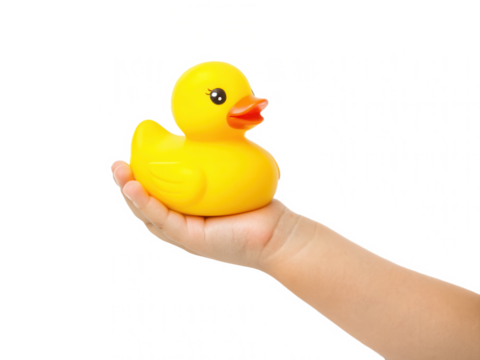 A hand holds a bright yellow rubber duck against a black background, highlighting its playful design and vibrant color.