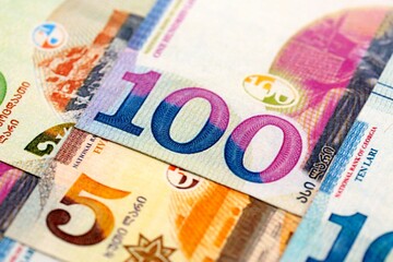 Georgian Lari currency money bills in heap. GEL currency banknotes with different denomination...