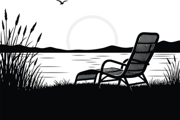 Silhouette of a lounge chair by a lake at sunset with reeds and bird