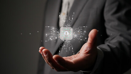 Businessman holding a holographic CPU with a user icon. Concept of cybersecurity, data protection, AI technology, and personal information privacy in the digital age.