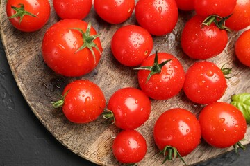 Fresh ripe tomatoes on grey table, flat lay