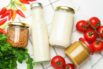 Different tasty sauces and vegetables on wooden table, flat lay