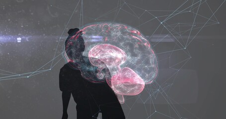 Studying researcher engaging with holographic brain model in dark lab, with digital network