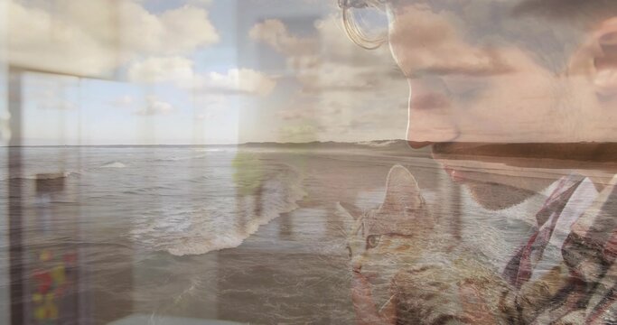 Cradling tabby cat plaid-shirt man in cabin with window showing ocean waves and clouds, copy space - Powered by Adobe