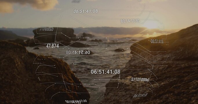 Fototapeta Flowing waves moving through seaweed-covered rocky inlet at sunrise, with HUD overlays