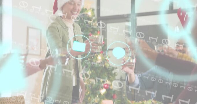 Standing, host wearing Santa hat toasting as tech icons animating with group clinking for holiday