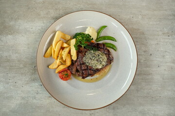 A culinary masterpiece: a succulent steak dish beautifully presented on a plate