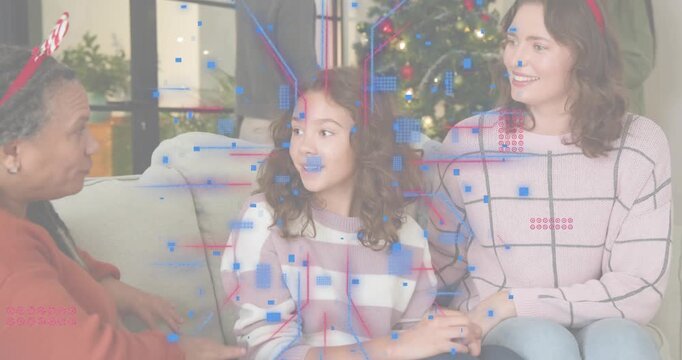 Man stepping aside letting pregnant mom hanging ornament and snowflakes drifting over holiday decor