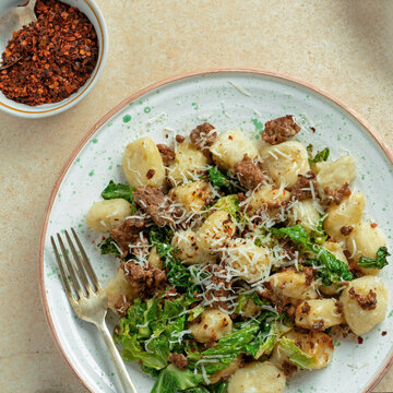 Healthy Gnocchi Dish with Kale and ground meat, top view