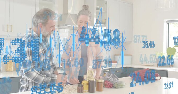 Senior couple picking jars up and comparing labels then organizing condiments for cooking tutorial