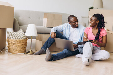 African couple planning relocation, moving into new house