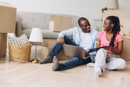 African couple planning relocation, moving into new house