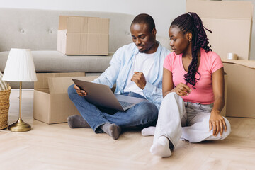 African couple planning new home on moving day