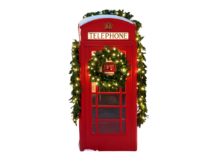 Red British Telephone Box Surrounded by Blooming Flowers in Spring Garden