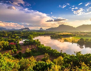 Picturesque view of a lush green valley with a river at sunset